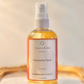 Aurora & Sol Watermelon Punch body and hair oil bottle on a neutral background