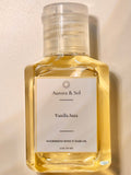 Aurora & Sol Vanilla Aura body and hair oil bottle on a beige background