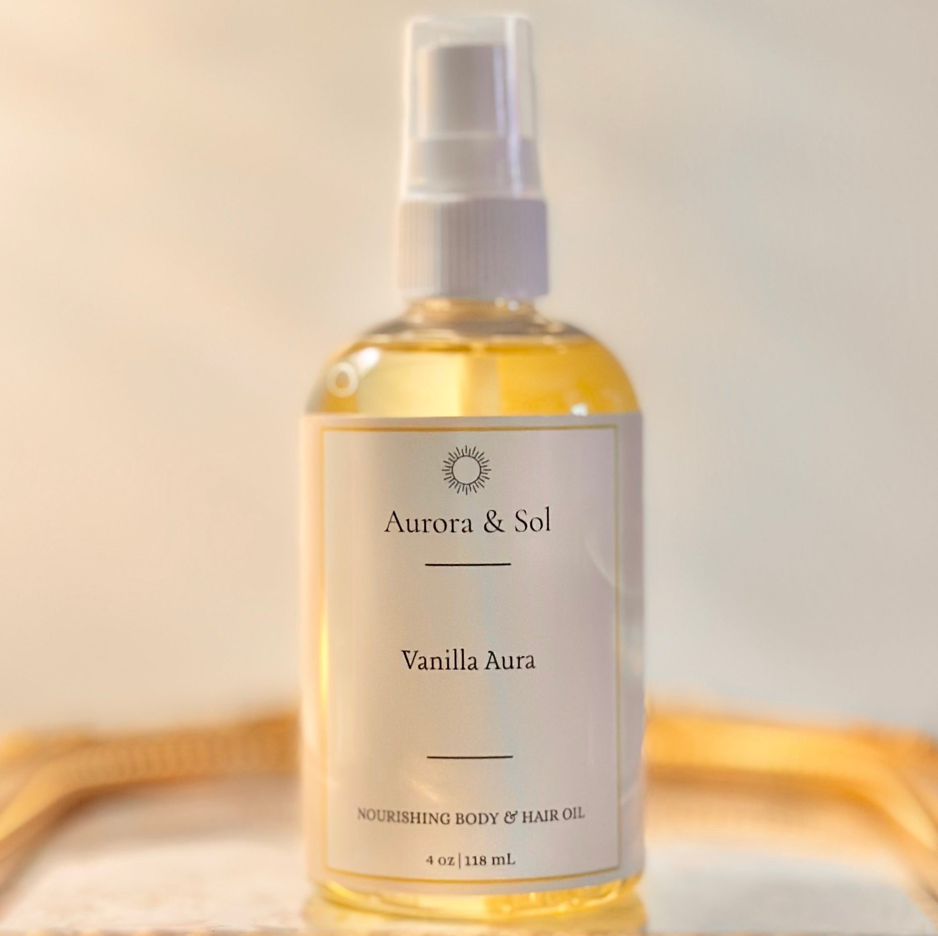 Bottle of Aurora & Sol Vanilla Aura body and hair oil on a light background