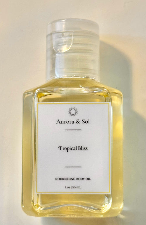 Aurora & Sol Tropical Bliss nourishing body oil trial size bottle on a light background